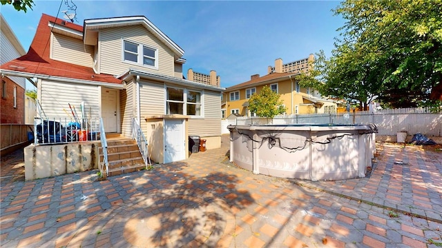 rear view of property with a patio area