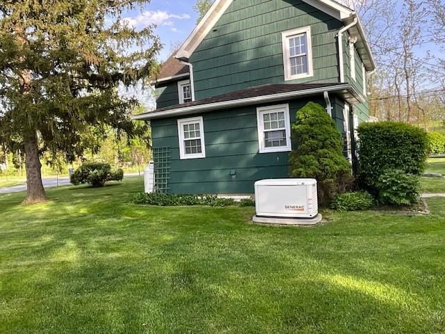 view of side of property featuring a yard