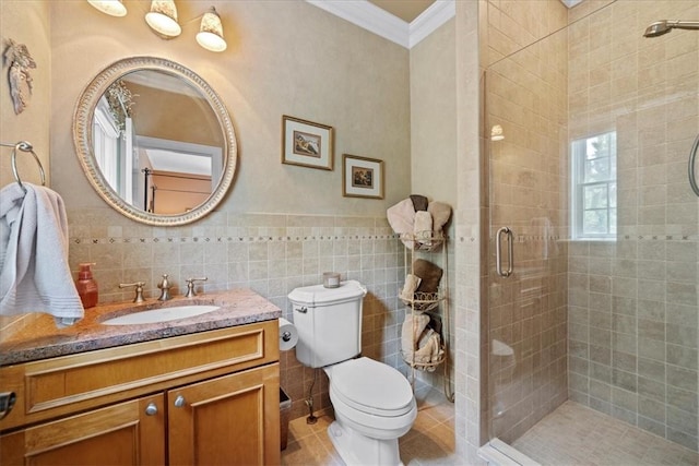 bathroom featuring vanity, tile patterned flooring, ornamental molding, tile walls, and walk in shower