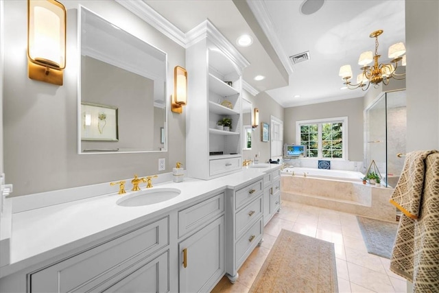 bathroom with tile patterned flooring, tiled bath, ornamental molding, and a notable chandelier