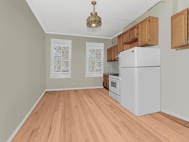 kitchen featuring light wood-type flooring, white appliances, crown molding, and backsplash