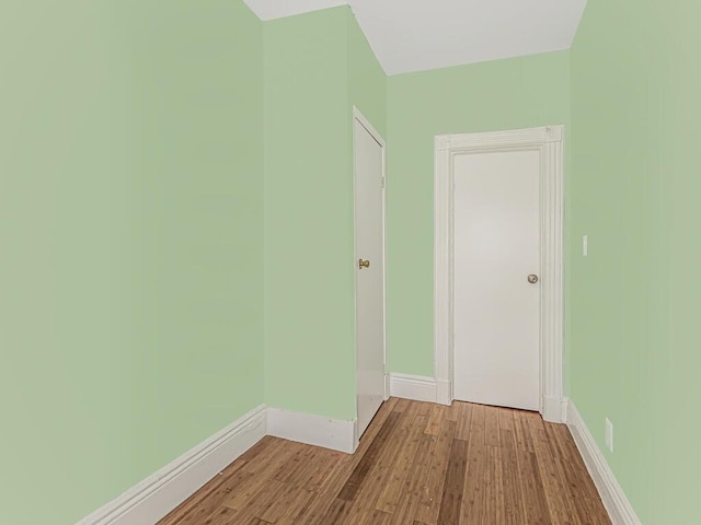 corridor with light wood-type flooring