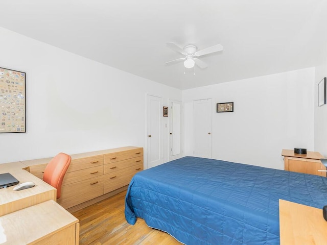 bedroom featuring ceiling fan and hardwood / wood-style floors