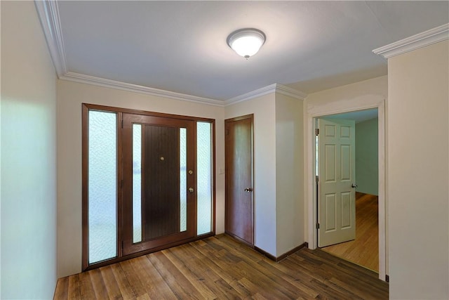 foyer entrance featuring dark hardwood / wood-style flooring and crown molding