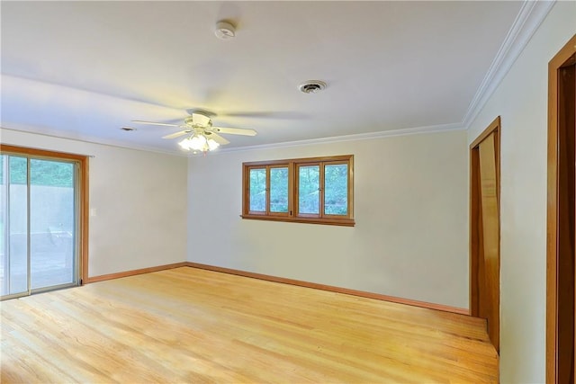 spare room with ceiling fan, light wood-type flooring, and crown molding