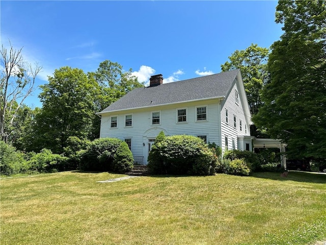 back of house with a yard