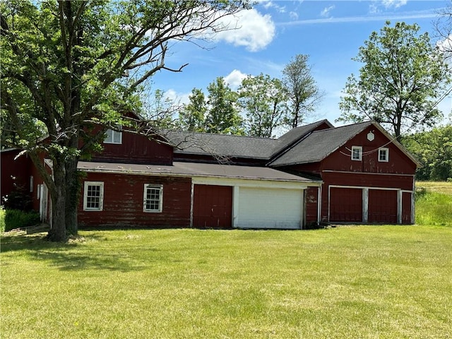 exterior space with a front yard and a garage