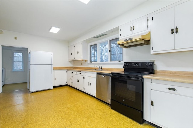 kitchen with electric range, dishwasher, white refrigerator, and plenty of natural light