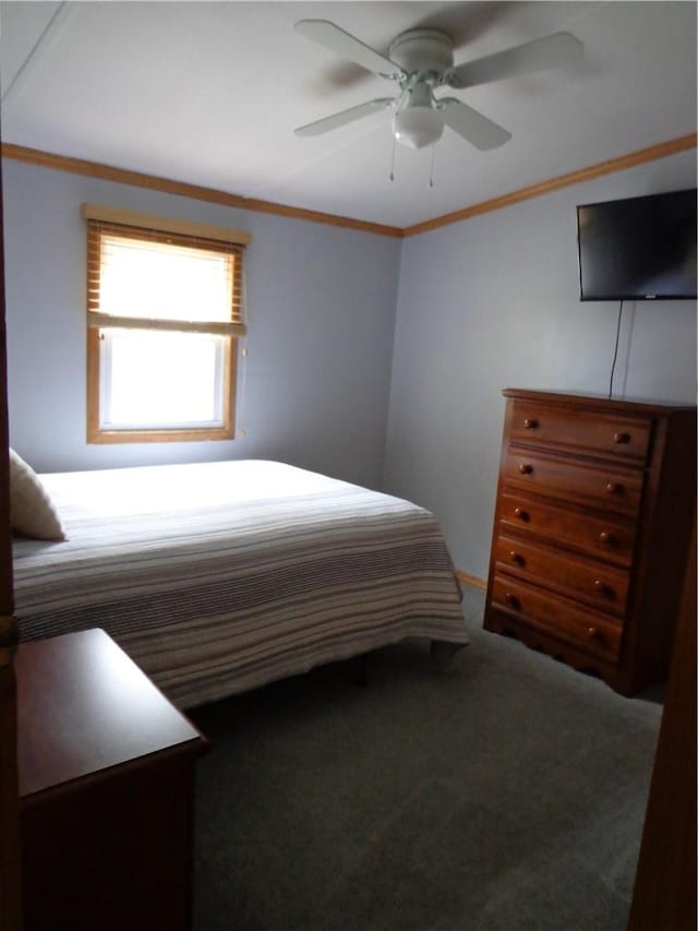 unfurnished bedroom featuring ceiling fan, carpet, and ornamental molding