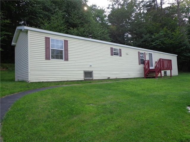 rear view of house with a lawn