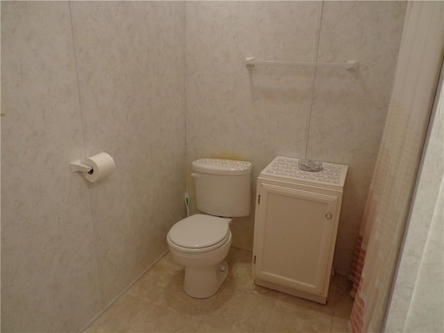 bathroom with tile patterned floors and toilet