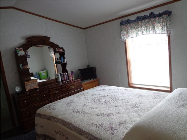 bedroom featuring crown molding and lofted ceiling