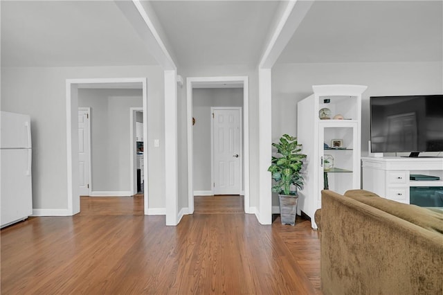 unfurnished living room with dark hardwood / wood-style floors