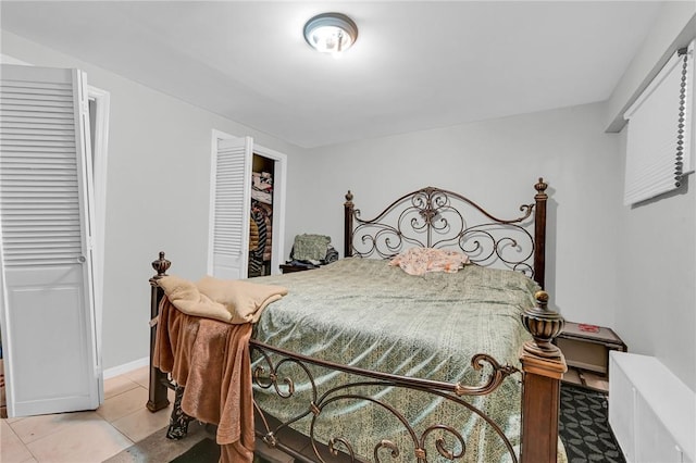 tiled bedroom featuring a closet