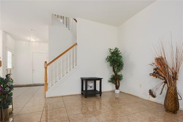 entrance foyer featuring light tile patterned flooring