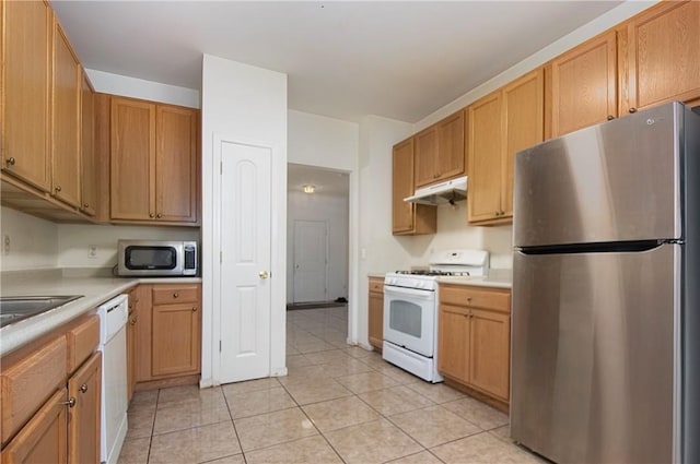 kitchen with light tile patterned floors and stainless steel appliances