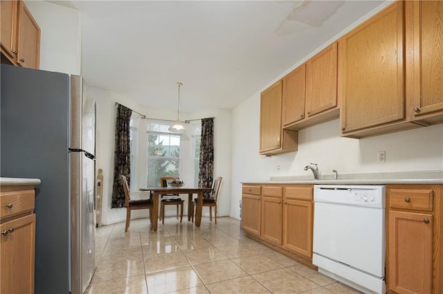 kitchen with stainless steel fridge, sink, decorative light fixtures, dishwasher, and light tile patterned flooring