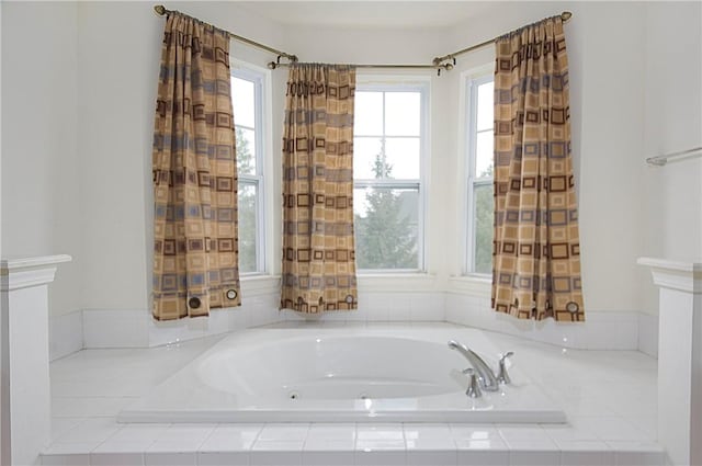 bathroom with tiled bath