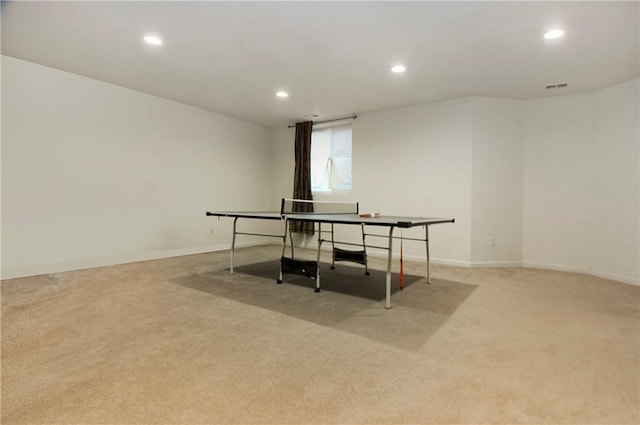 recreation room with light carpet