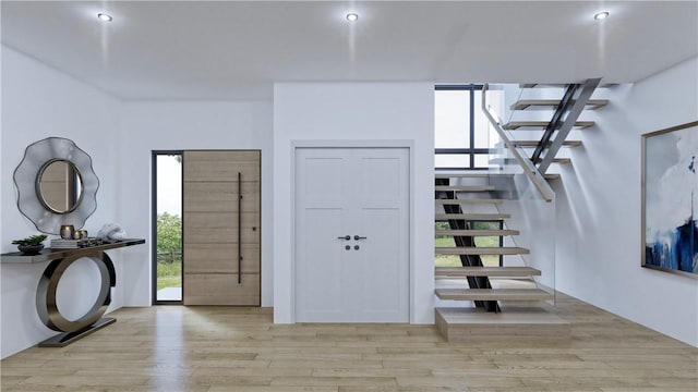 foyer with a healthy amount of sunlight and light wood-type flooring