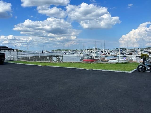 view of parking / parking lot with a water view