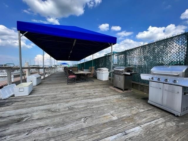 wooden deck with a grill