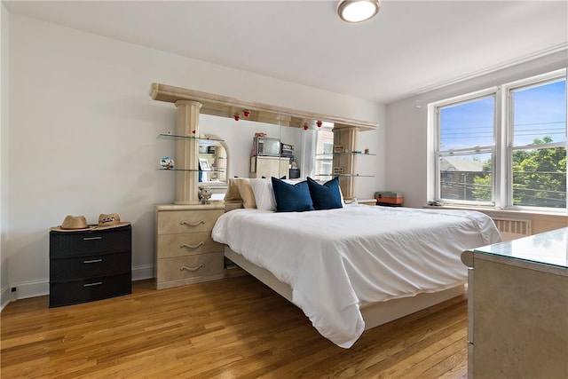 bedroom featuring hardwood / wood-style flooring