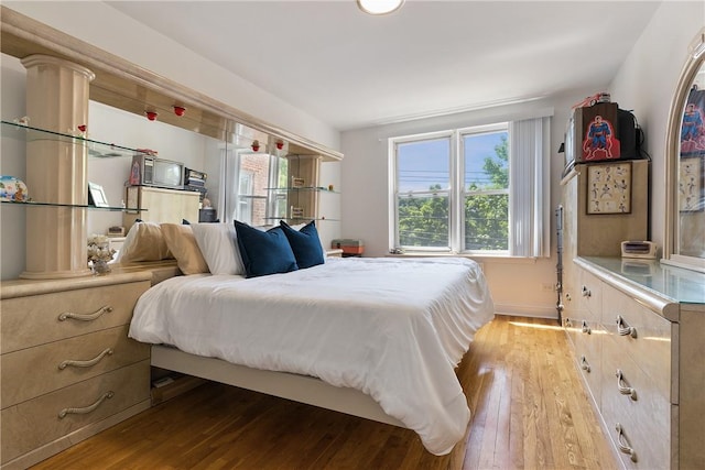 bedroom with light wood-type flooring