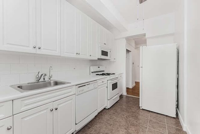 kitchen with white cabinets, white appliances, tasteful backsplash, and sink