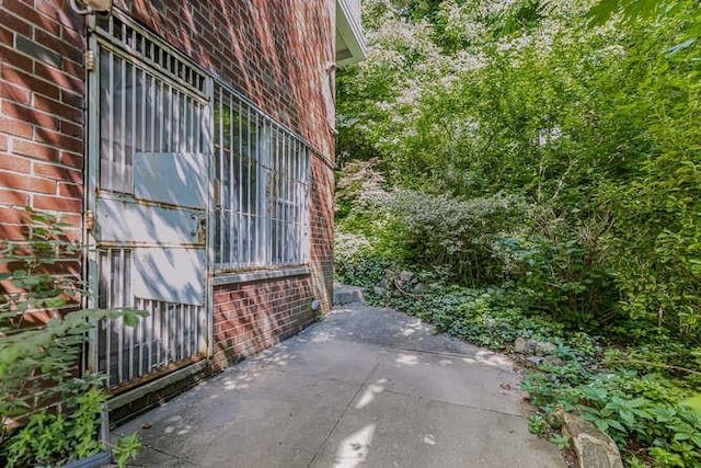 view of side of property featuring a patio area