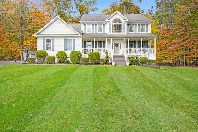 colonial inspired home with covered porch and a front lawn