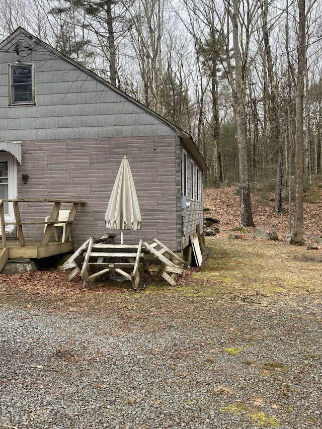 view of home's exterior featuring a deck