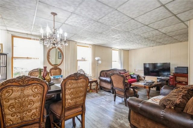 living room with a chandelier and wood-type flooring