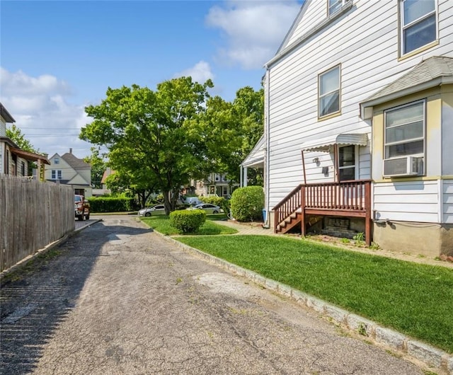 view of property exterior featuring a yard