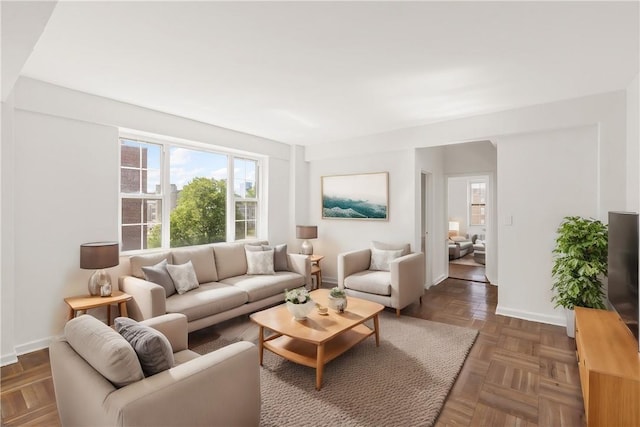 living room with dark parquet flooring