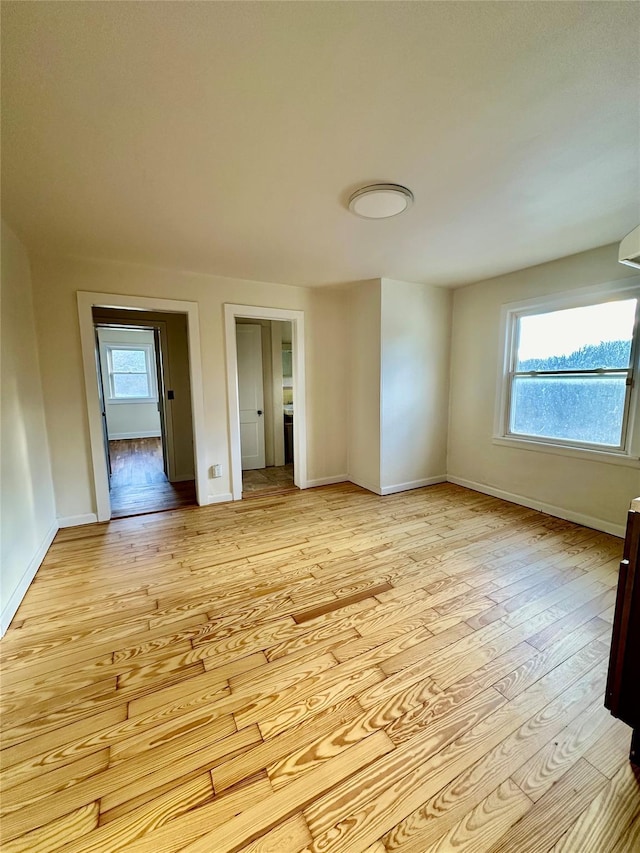 spare room with light hardwood / wood-style floors