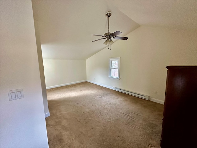 additional living space with ceiling fan, carpet, a baseboard radiator, and lofted ceiling