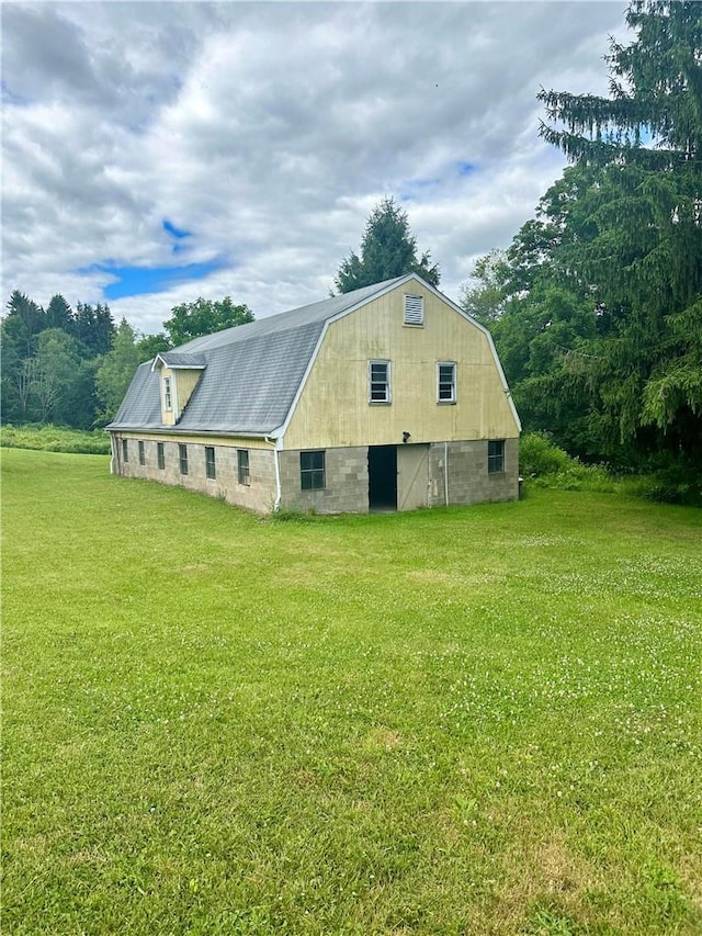 view of home's exterior featuring a yard