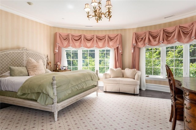 bedroom with wallpapered walls, ornamental molding, a notable chandelier, and multiple windows