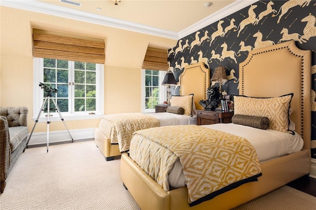 bedroom featuring visible vents, baseboards, ornamental molding, and carpet floors