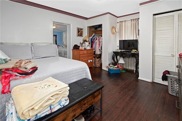 bedroom featuring dark hardwood / wood-style flooring, a closet, and crown molding