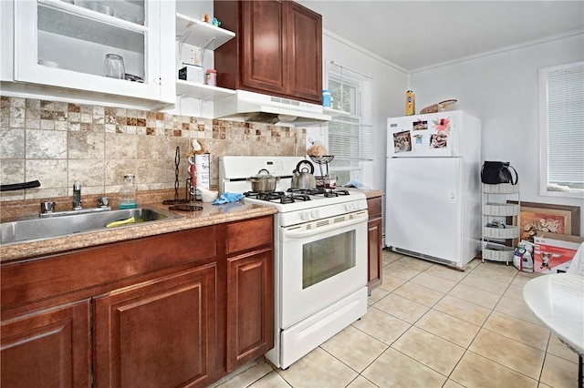 kitchen featuring sink, backsplash, crown molding, white appliances, and light tile patterned flooring