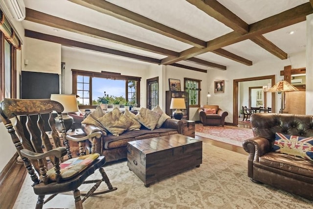 living room with beamed ceiling, hardwood / wood-style floors, and a wall mounted air conditioner