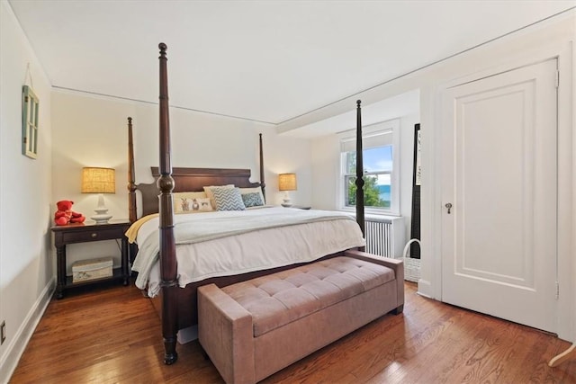 bedroom with hardwood / wood-style flooring