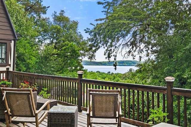 wooden deck featuring a water view