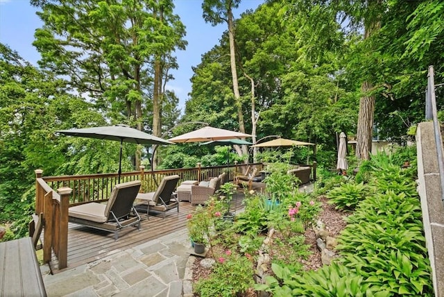 wooden terrace with an outdoor hangout area