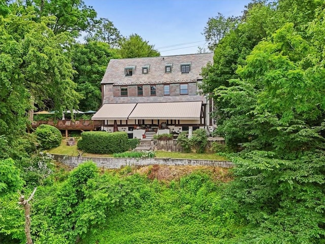 rear view of property with a deck