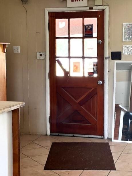 entryway featuring light tile patterned flooring