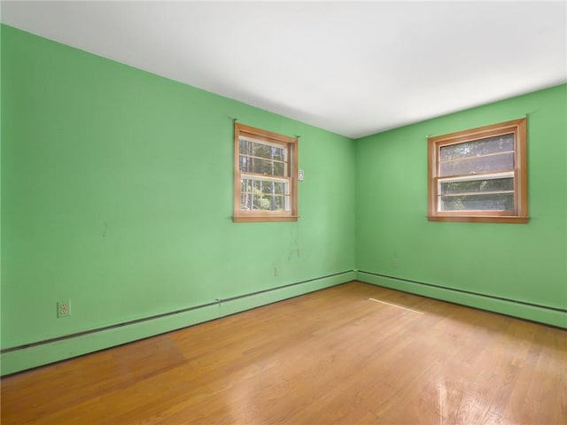 1124 State Route 42, Sparrowbush, NY 12780 - spare room with wood finished floors and baseboard heating