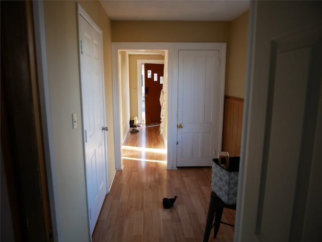 corridor with light wood-type flooring